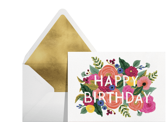 An envelope with gold lining; a card with flowers reads 'happy birthday.'